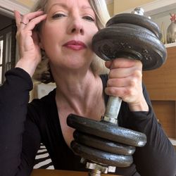 Marci Bowman - The Wonderfulness Community - Marci posing with 15-pound weight