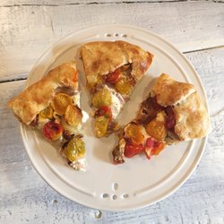 Nomad Coffee - Roasted tomato galette with honeyed goat cheese & caramelized onions.