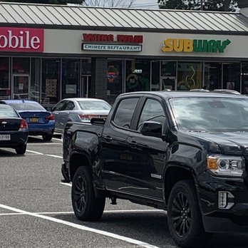 Wing Wah - Centereach - a black pickup truck parked in a parking lot - Chinese Near Me - Centereach, New York Wing Wah - Centereach - a black pickup truck parked in a parking lot - Chinese Near Me - Centereach, New York