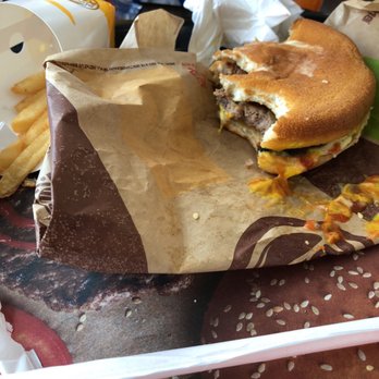 Burger King - a hamburger and fries on a table - Burgers Near Me - Tuscola, Illinois