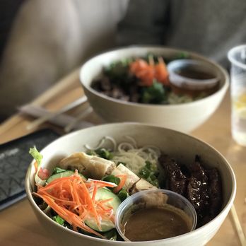 Pho Sure - two bowls of food on a table - Vietnamese Near Me - Raleigh, North Carolina Pho Sure - two bowls of food on a table - Vietnamese Near Me - Raleigh, North Carolina