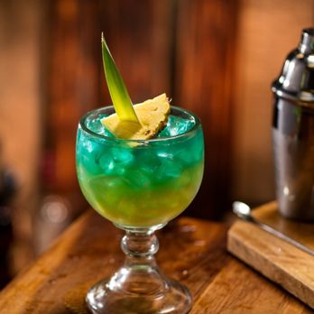 Cheddar's Scratch Kitchen - Island Tiki: Captain Morgan, Malibu rums, tropical mango purée, pineapple juice, sweet & sour and blue curaço. - American Near Me - Lexington, Kentucky