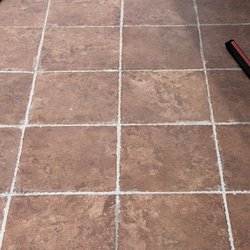 Force Masonry - This is just an example of the messy grout work. They didn't wipe away the residue and didn't clean up around the grooves of the tile.