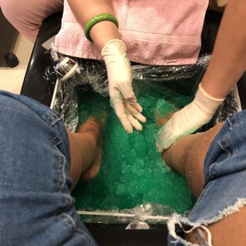 Pink Salon - Jojo doing the "jelly pedicure"....she lied and said I requested for a longer massage so she charged me $65 with NO POLISH! - Nail Salons Near Me - Middletown, New Jersey