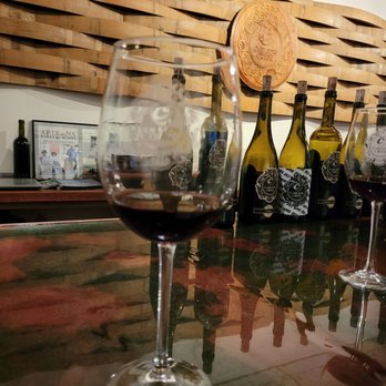 Carlson Creek Vineyard - a glass of wine on a bar - Wine Tasting Room Near Me - Scottsdale, Arizona Carlson Creek Vineyard - a glass of wine on a bar - Wine Tasting Room Near Me - Scottsdale, Arizona
