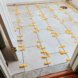 Kraus Restoration - This is a picture of the NEW bathroom floor in progress of being installed.