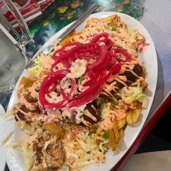 El Tio Tienda Latina Savadorian - chuleta con tajadas