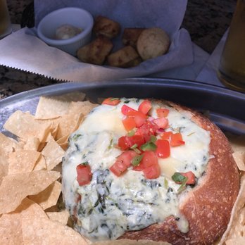 Saddle Ranch - Creamy Spinach & Artichoke Dip & Jalapeño cornbread biscuits - Steakhouses Near Me - Orange, California