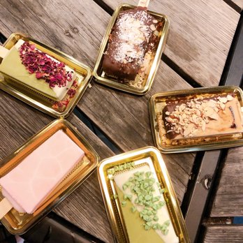 Fantasticks - four trays of desserts on a wooden table - Gelato Near Me - Ashburn, Virginia