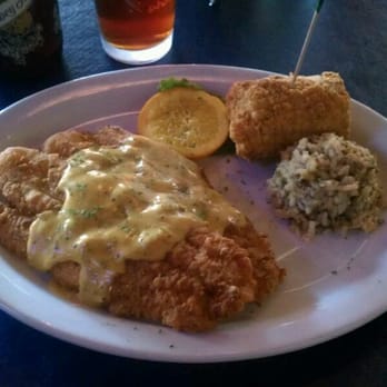 Blind Tiger - Pecan crusted catfish with fried corn and dirty rice, Abita abbey ale in tgr background. - Cajun/Creole Near Me - Shreveport, Louisiana Blind Tiger - Pecan crusted catfish with fried corn and dirty rice, Abita abbey ale in tgr background. - Cajun/Creole Near Me - Shreveport, Louisiana
