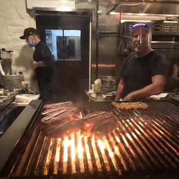 Charolais Steakhouse - Grilling steaks over an open flame. - Steakhouses Near Me - Hickory, North Carolina Charolais Steakhouse - Grilling steaks over an open flame. - Steakhouses Near Me - Hickory, North Carolina