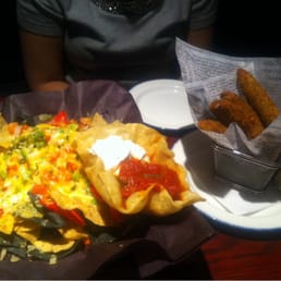 1/2 order of nachos and deep fried pickles 1/2 order of nachos and deep fried pickles