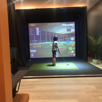 Social Lounge 365 - a man playing a golf game - Tacos Near Me - Mount Laurel Township, New Jersey