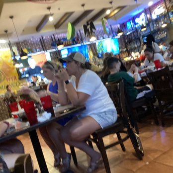Jalapeños - a group of people sitting at a table - Mexican Near Me - Pooler, Georgia