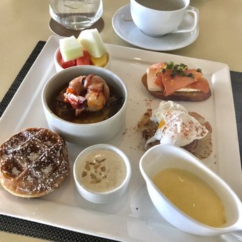 Plumeria Beach House - Breakfast Special. Fruits, Smoked Salmon toast, mini Crab Cake Benedict, Mochi Waffle, Bacon Wrapped Shrimp on Polenta. - Breakfast & Brunch Near Me - Honolulu, Hawaii Plumeria Beach House - Breakfast Special. Fruits, Smoked Salmon toast, mini Crab Cake Benedict, Mochi Waffle, Bacon Wrapped Shrimp on Polenta. - Breakfast & Brunch Near Me - Honolulu, Hawaii