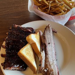 This is one of the combo plates for I believe $22. The ribs and the fries were outstanding. That's actually three slabs of brisket. This is one of the combo plates for I believe $22. The ribs and the fries were outstanding. That's actually three slabs of brisket.