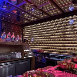 Bar seating view with the lucky cat wall