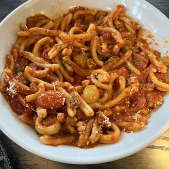 Al'Lupo Ristorante - CASARECCE ALLA NORMA $28 HONOR OF CHEF PELONI'S NONNA SAUTED EGGPLANT, POMODORO, CHERY TOMATOES, SHAVED RICOTTA SALATA - Italian Near Me - Cincinnati, Ohio