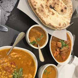 Plain naan, chicken dalwala, lentils, potatoes, a bhuna gosht. Plain naan, chicken dalwala, lentils, potatoes, a bhuna gosht.
