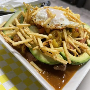 Palmas Colombian Restaurant - All the meats with a delish sauce topped with egg and potato sticks - Colombian Near Me - Pembroke Pine, Florida