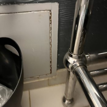 Sheraton Arlington Hotel - Rusted access panel in bathroom - Hotels Near Me - Arlington, Texas