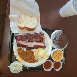 Fritze's BBQ & Catering - Pork ribs plate with pinto beans & potato salad, chocolate cake & peach cobbler