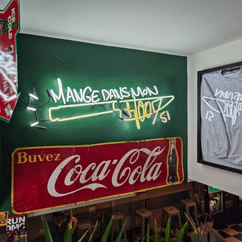 Casse-Croûte MangeDansMonHood - a coca cola sign in a restaurant - Burgers Near Me - Montreal, Quebec Casse-Croûte MangeDansMonHood - a coca cola sign in a restaurant - Burgers Near Me - Montreal, Quebec