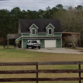 Arocha Enterprise - a car parked in front of a house - Roofing Near Me Arocha Enterprise - a car parked in front of a house - Roofing Near Me