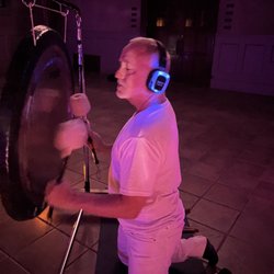 Century Wellness Studio - Barry playing the gong lifting the audience higher