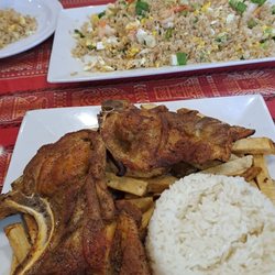 Resa Grill - Chuletta con arroz y papas in the foreground. Chaufa de Cameron in the background.