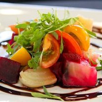 Taste Collective - a white plate with a salad on it - Food Trucks Near Me Taste Collective - a white plate with a salad on it - Food Trucks Near Me