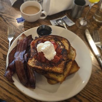Spaghettini - Monster french toast topped with strawberries and whipped cream with a pile of bacon - Italian Near Me - Seal Beach, California