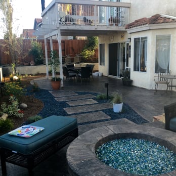 3 Rivers Outscapes & Tree Service - My gorgeous fire pit and poured and stamped pavers/beach pebble path. - Landscaping Near Me