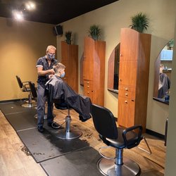 Austin Phillip's Hair Studio - Staff and customers wear masks
