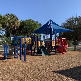 South County Triplex Park - Partially cover playground equipment with wood chips to keep kids safe and its fenced in. - Parks Near Me - Boca Raton, Florida