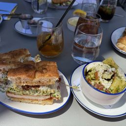 Delicious Chicken Parmesan Caesar sandwich and pesto salad.