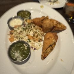 Cooper’s Hawk Winery & Restaurant - Egg rolls and dipping sauce with some slaw in middle. Wed already dug in at this point. 3 at least are missing. A must get