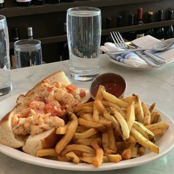 Neptune Oyster - Maine Lobster Roll Sandwich (hot with butter) served with fries - Seafood Near Me - Boston, Massachusetts