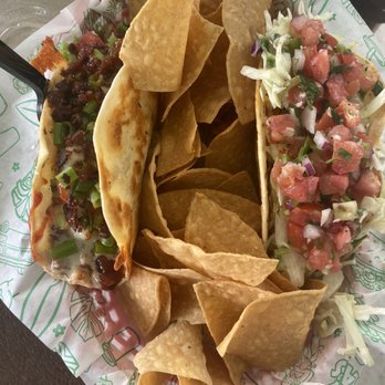 Jimmy Hulas - Taco of the month on the left (brisket, scallions, cheese tortilla, bacon dust) and epic on the right - Tacos Near Me - St. Augustine, Florida Jimmy Hulas - Taco of the month on the left (brisket, scallions, cheese tortilla, bacon dust) and epic on the right - Tacos Near Me - St. Augustine, Florida