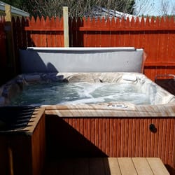 Heaven's Door - This is the outside hot tub during a nice sunny day. It is totally enclosed for your privacy.