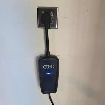 Nextdoor Electric - Audi plug-in car charging adapter in the new wall outlet installed by Nextdoor Electric - Electricians Near Me - Houston, Texas