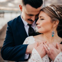 Fly The Coop - Bride & Groom Embrace at Lake Coeur d'Alene, ID - Photos by Kendra with Earthbound Photography
