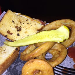 My barely toasted grilled cheese with embedded grill remnants and what appeared to resemble a pickle.  But O-rings were good.