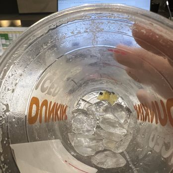Dunkin' -  a person holding a glass of water - Donuts Near Me - Morris Plains, New Jersey