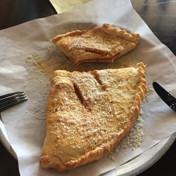 Antonious Pizza Cafe - Delicious calzone (half eaten) lol - Pizza Near Me - Riverside, California