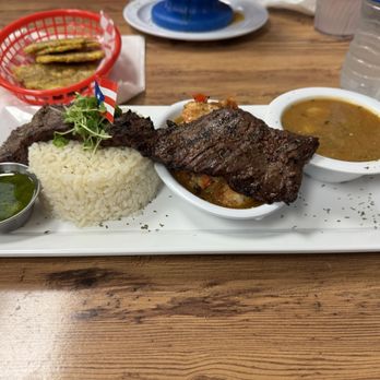 Manjar Criollo - Churrasco and shrimp in sauce with white rice, beans and tostones. - Puerto Rican Near Me - Haines City, Florida