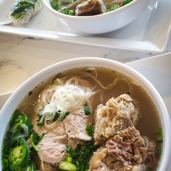Nine Five Pho - Super Đặc Biệt (P7)  Beef brisket, beef flank, beef tendon, beef tripe, beefball, steak with beef broth  and  Short Rib Phở (P5) - Vietnamese Near Me - Pembroke Pines, Florida