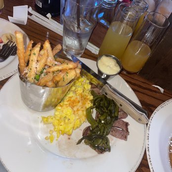 The Oakmont - Steak and eggs with a Mimosa and a peach Bellini to wash it down!! - American Near Me - Indianapolis, Indiana The Oakmont - Steak and eggs with a Mimosa and a peach Bellini to wash it down!! - American Near Me - Indianapolis, Indiana