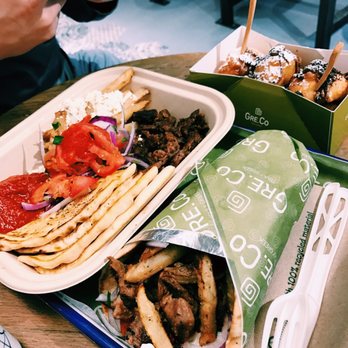 GRECO - Lamb plate on the left, Yaya loukoumades at the top, pork pita on the bottom - Greek Near Me - Boston, Massachusetts GRECO - Lamb plate on the left, Yaya loukoumades at the top, pork pita on the bottom - Greek Near Me - Boston, Massachusetts