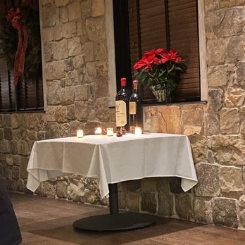 Addams Tavern - a table with candles and a bottle of wine - New American Near Me - Westfield, New Jersey Addams Tavern - a table with candles and a bottle of wine - New American Near Me - Westfield, New Jersey